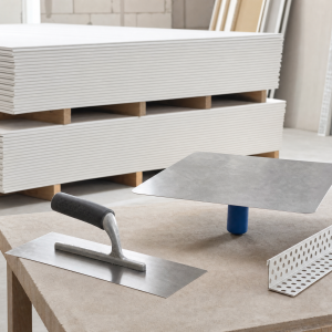 Plasterboard sheets, plastering trowel, hawk and corner bead